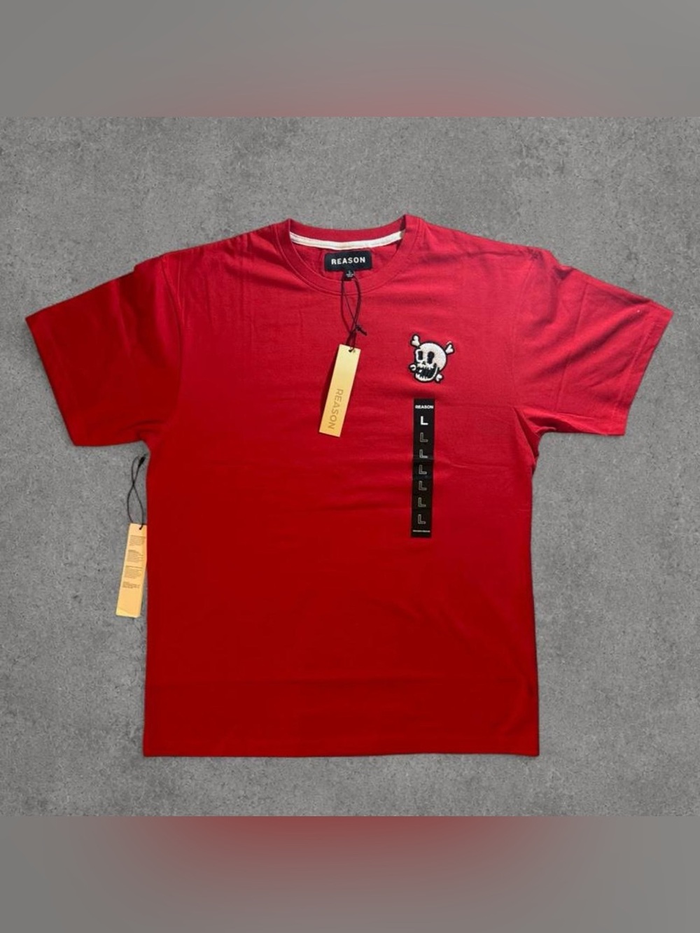 Red Reason brand t-shirt with white skull graphic